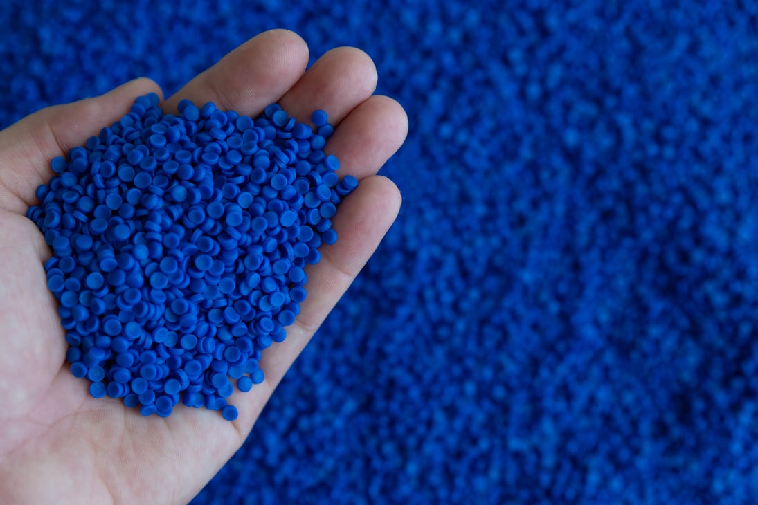 Close-up of plastic polymer granules. hand hold Polymer pellets. polymer plastic. compound polymer.